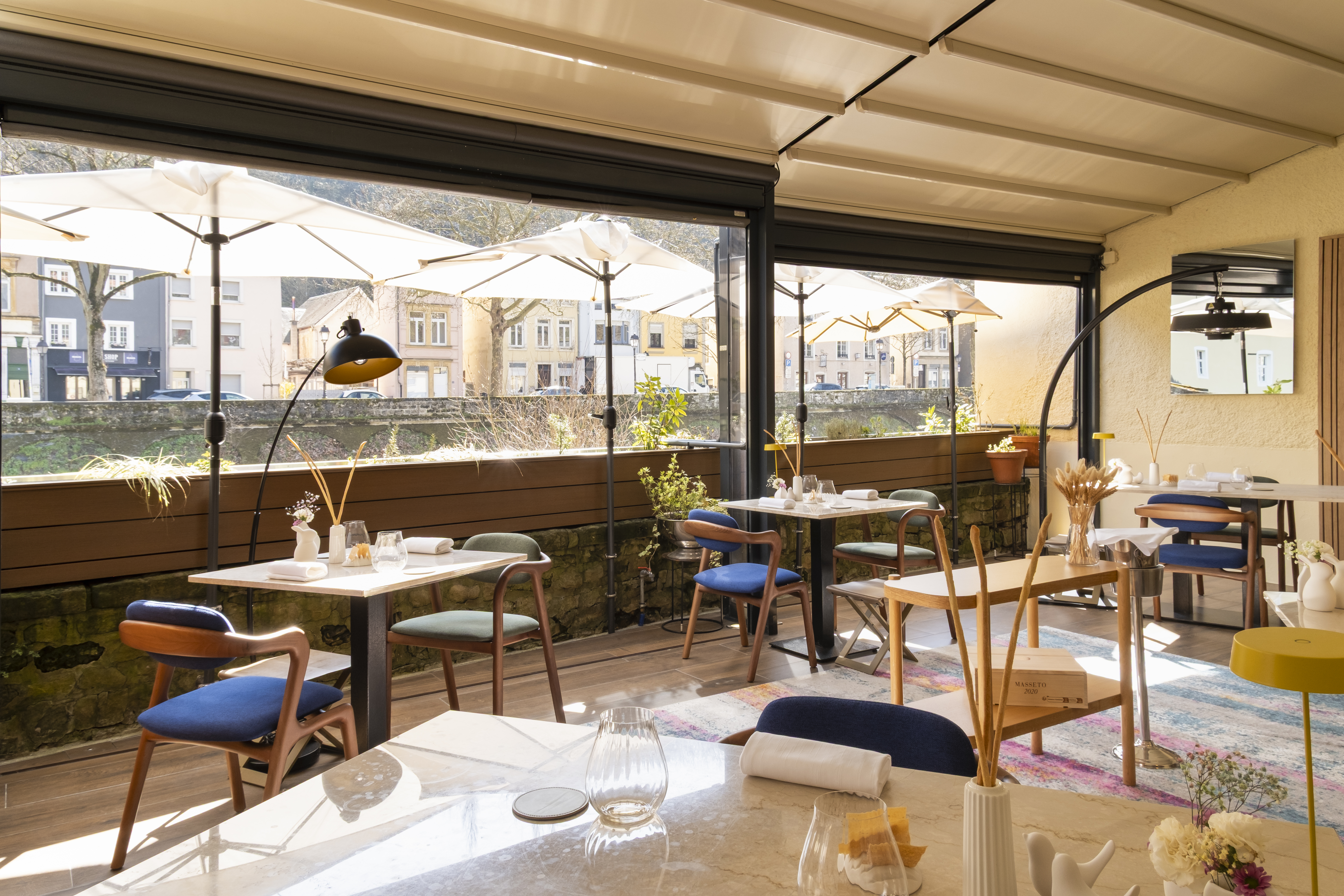 The dining room looking out to the terrace and the houses of Clausen across the water